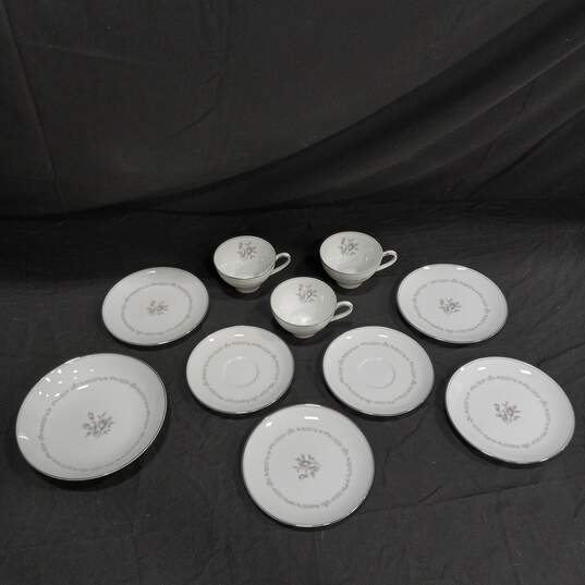 Bundle of Assorted White Noritake Saucer, Tea Cups & Plates w/ Floral Design image number 1