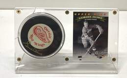 Encased Trading Card & Hockey Puck Signed by Gordie Howe - Detroit Red Wings