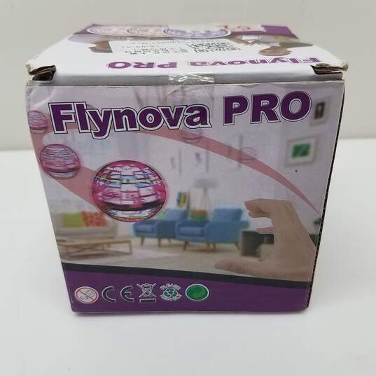 Flynova-Pro Flying Ball Toy Boomerang Spinner Hand Operated Drone Pink image number 1