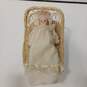 Heritage Doll "Laura" Porcelain Music Box with Bassinet image number 1