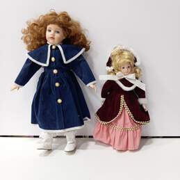 Vintage Pair of Porcelain Dolls w/Clothing