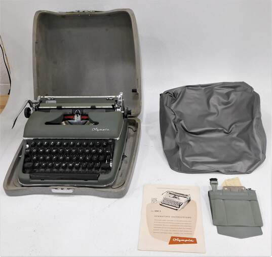 Vintage Olympia SM3 DeLuxe Portable Manual Typewriter W/ Case & Manual image number 1