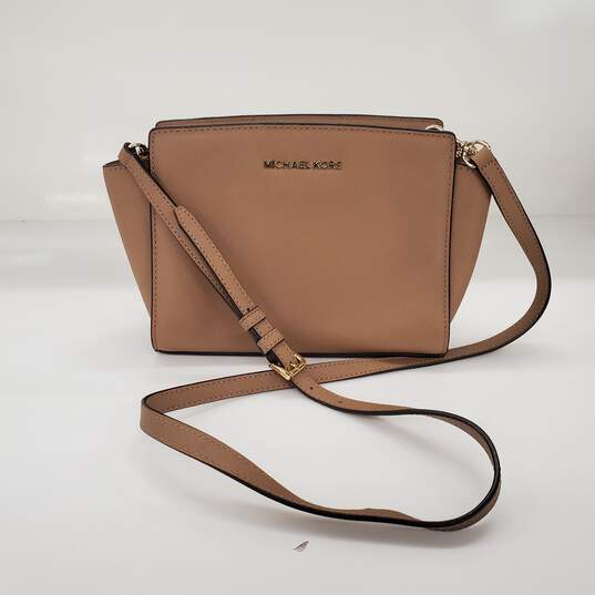 Buy the Michael Kors Selma Beige Saffiano Leather Crossbody Bag Small
