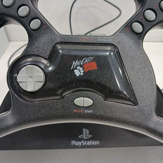 Mad Catz Analog/Digital Steering Wheel W/Foot Pedal for PlayStation IOB