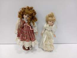 Bundle of 2 Assorted Porcelain Dolls w/ Stands