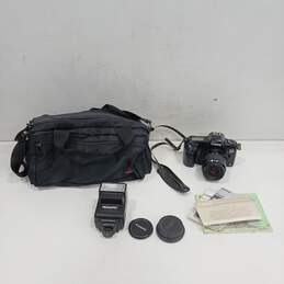 Canon EOS Rebel II Camera and Promatic Auto Focus Flash in Coast Soft Shoulder Carry Bag