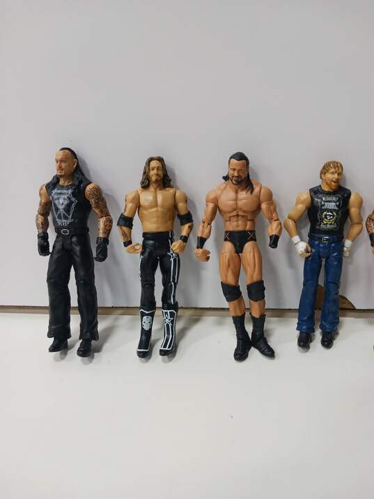 Lot of 8 Assorted WWE Wrestling Action Figures & Accessories image number 3