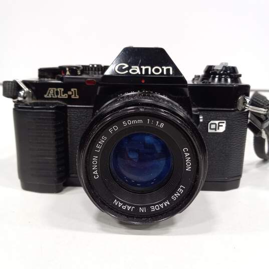 Black Canon AL-1 Vintage Film Camera In Bag w/ Accessories image number 2
