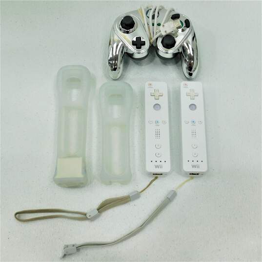 Nintendo Wii With 2 Games, 3 Controllers, 2 Nunchucks, and 1 Stand Including Just Dance 2017 image number 9