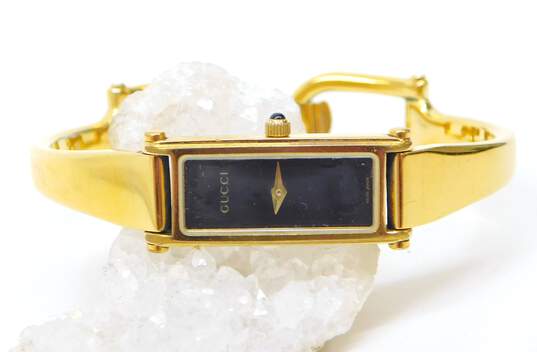 Gucci 1500 L Gold Tone Black Dial Swiss Quartz Bracelet Watch 27.9g image number 1