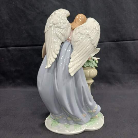 Figurine of Women With Wings Looking At Dove image number 3