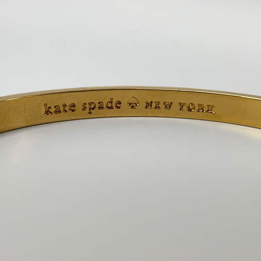 Designer Kate Spade Gold-Tone Pink White Round Fashion Bangle Bracelet image number 3