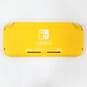 Yellow Nintendo Switch Lite W/ 2 Games Portal Knights Carnival Games image number 3