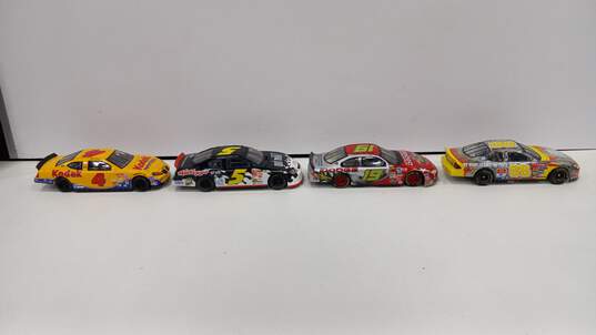 Bundle of 4 Assorted Racing Champions Toy Cars image number 1