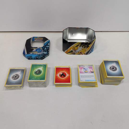 Bundle of Assorted Pokemon Cards In Tin image number 1