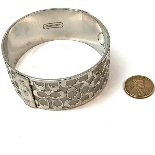 Designer Coach Silver-Tone Signature Engraved Round Shape Bangle Bracelet image number 2