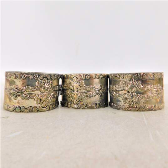 Lot of 3 Vintage Silver-plate Embossed Napkin Rings image number 1