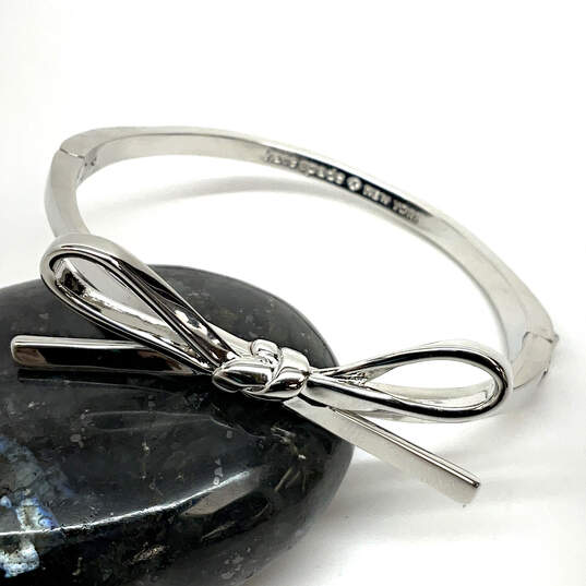 Designer Kate Spade Silver-Tone Bow Hinged Bangle Bracelet With Dust Bag image number 1