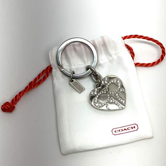 Buy the Designer Coach Silver-Tone Crystal Heart Locket Keychain With Dust  Bag