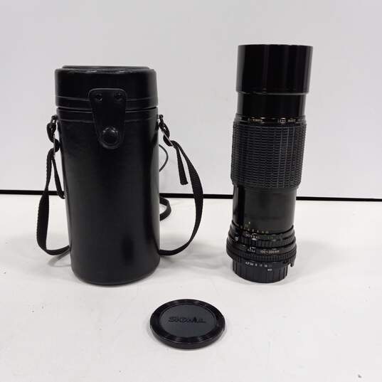 Sigma Camera Lens In Black Leather Case image number 1