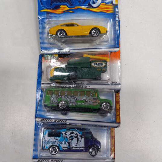 Bundle of Four Hot Wheels Cars with Storage Case image number 2