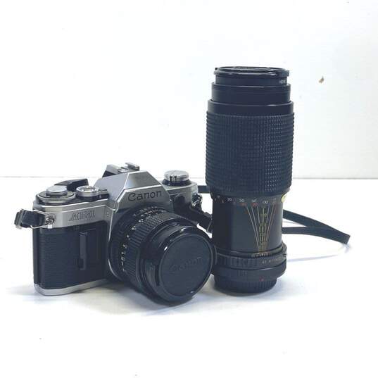 Canon AE-1 35mm SLR Camera with 2 Lenses image number 1