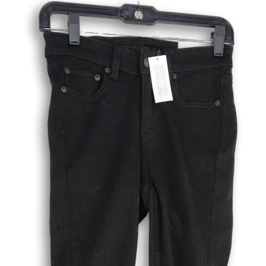 NWT Womens Black Denim Dark Wash Distressed Skinny Leg Jeans Size 4 image number 3