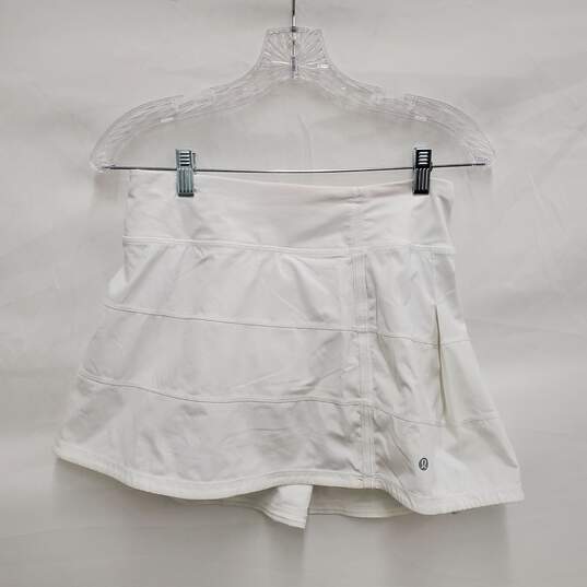 Lululemon Athletica WM's Mid-Rise Snow White Tennis Skirt Size 4 Tall image number 1