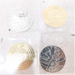 Pokemon TCG Metal Charizard UPC & Arceus UPC Coin Lot of 4