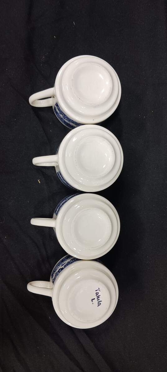 Bundle of 4 Vintage White and Blue Ceramic Stacking Tea Cups image number 4
