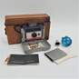 Vintage Polaroid Land Camera 104 w/ Flash Bulbs, Manuals & Leather Case Untested image number 1