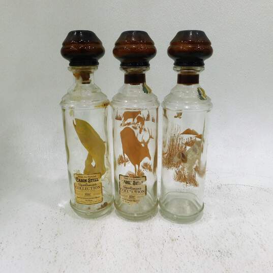 Set of 3 Vintage 1960s Cabin Still Sportsman's Collection Bourbon Whiskey Decanters image number 1