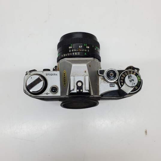 UNTESTED Sliver/Black Canon AE-1 Film Camera Bundle with 3 lenses, Flash & Bag image number 4