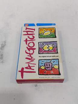 Bandai 1996-1997 Vintage Tamagotchi Yellow Electronic Game IOB