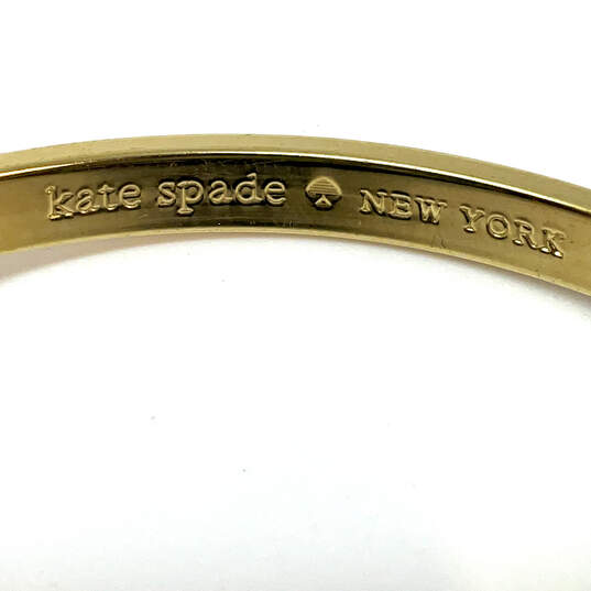 Designer Kate Spade Gold-Tone Round Idiom Fashionable Bangle Bracelet image number 4