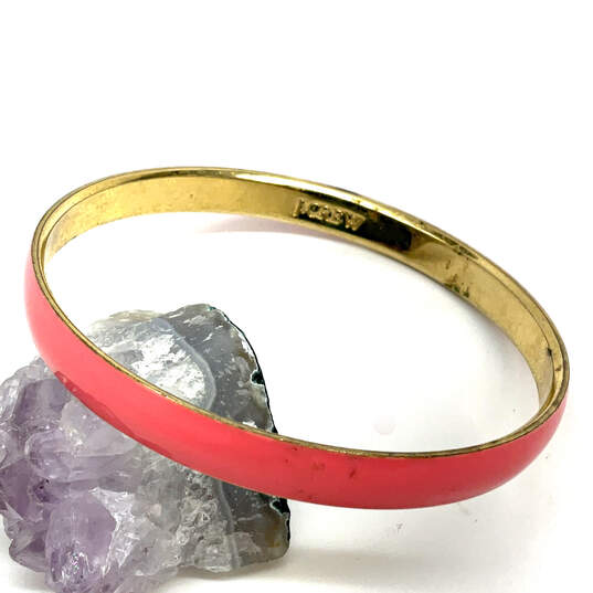 Designer J. Crew Gold-Tone Pink Enamel Round Shape Bangle Bracelet image number 1