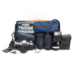 Canon AE-1 Program 35mm Film Camera w/ 3 Lens, Lens Converter, Flash & Bag