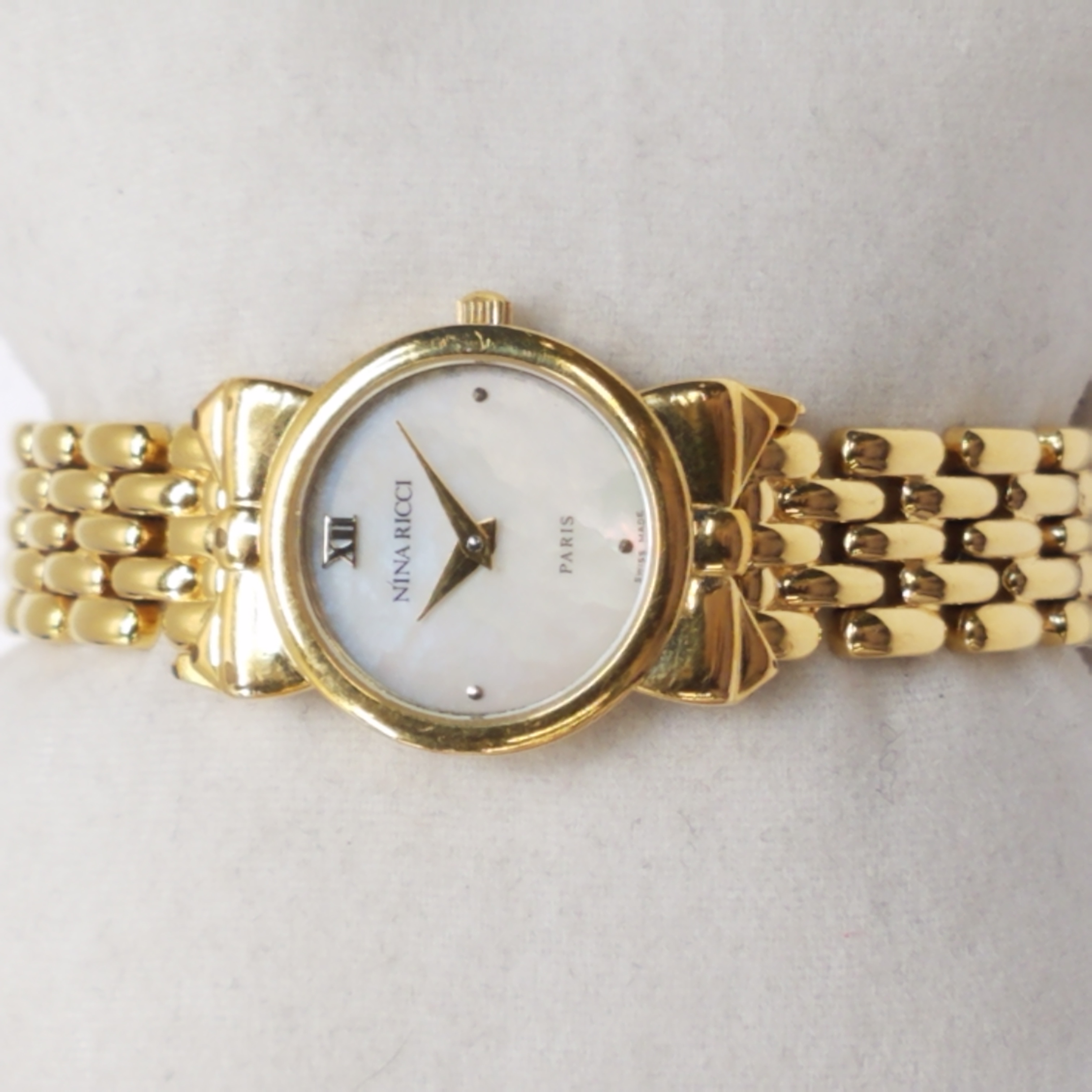Buy the Nina Ricci 30405/S953 Gold Plaque Or Gio MC W/ MOP Dial Watch ...