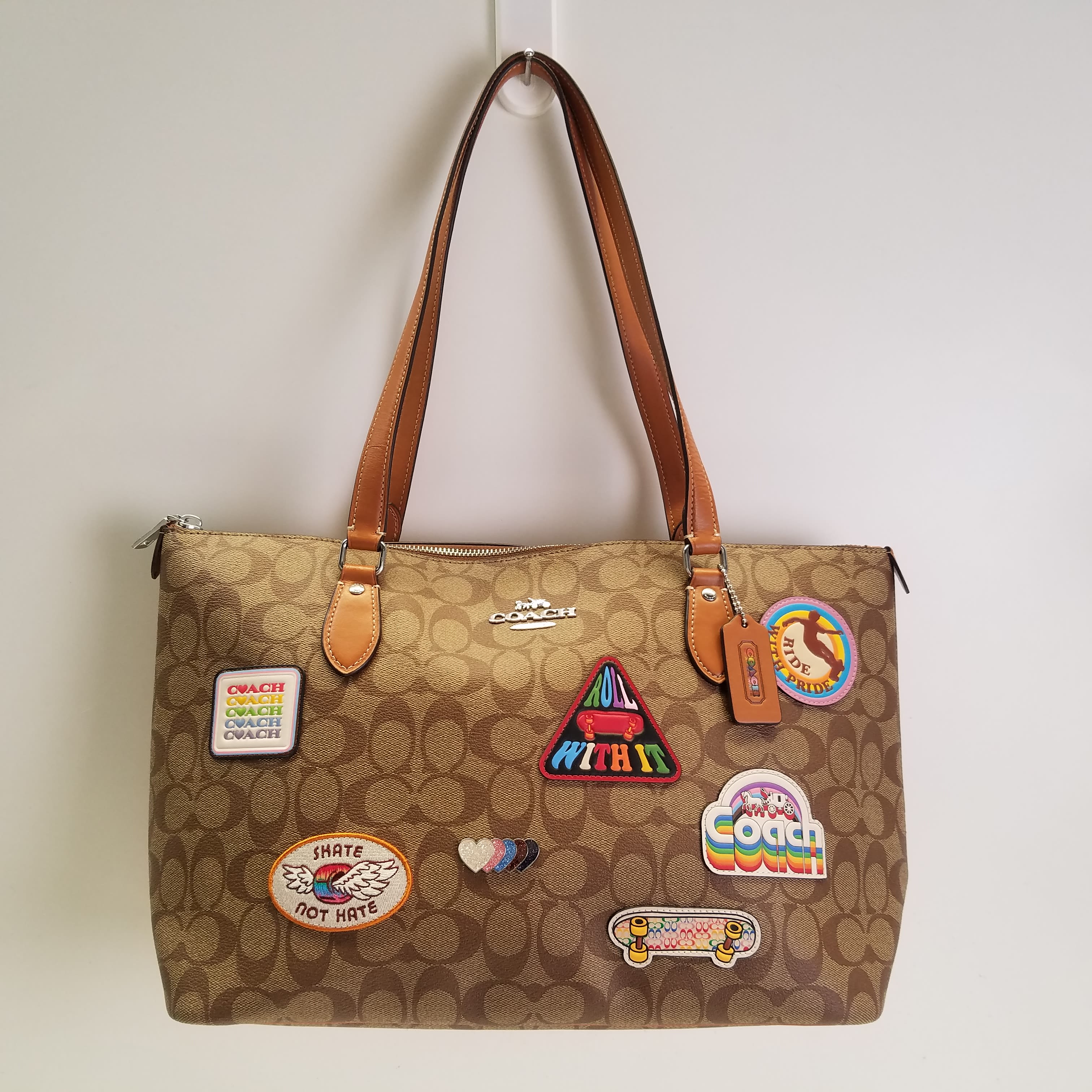 Buy the Coach Gallery Signature Canvas Pride Patches Tote Beige
