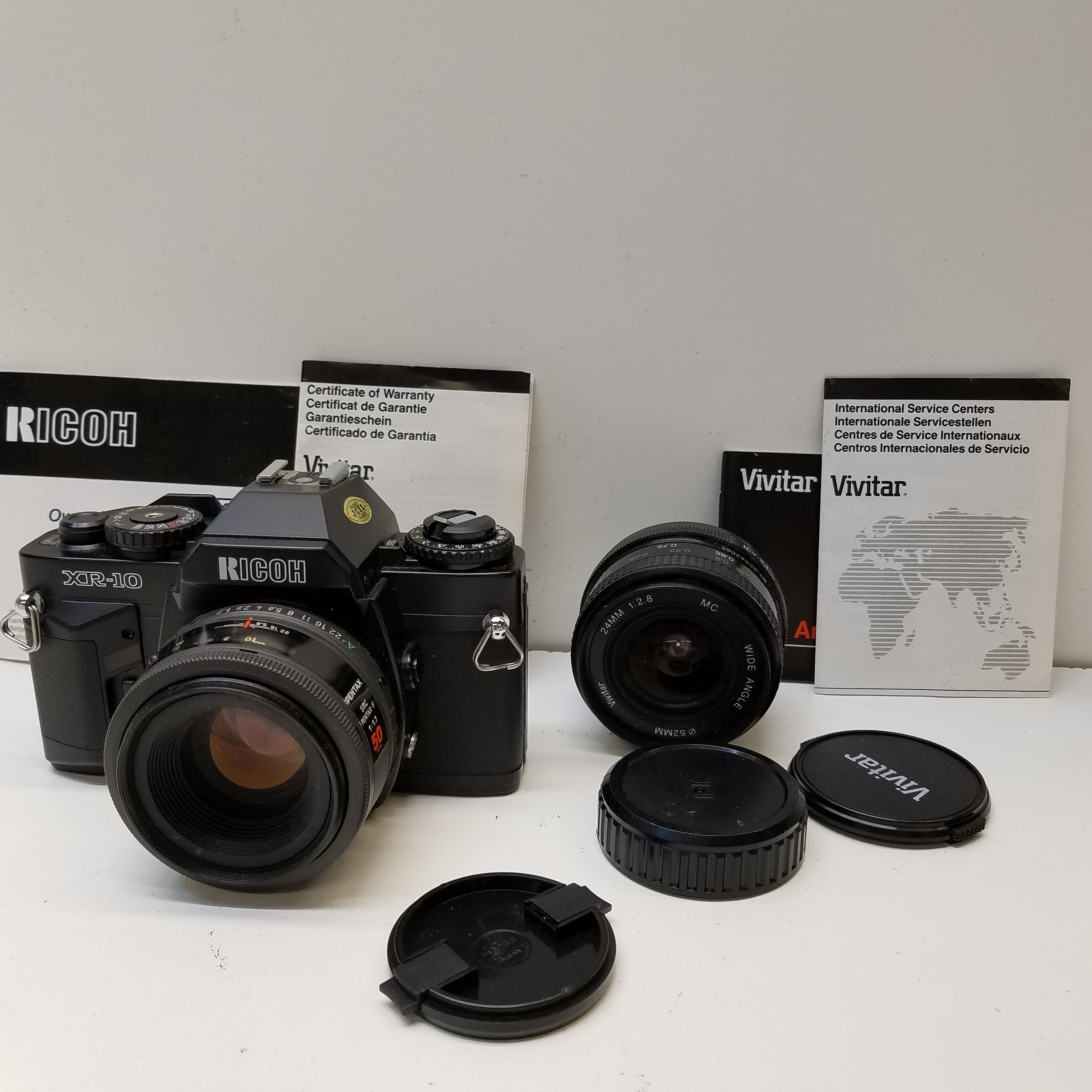Buy the Ricoh XR-10 35mm SLR Camera with 2 Lenses GoodwillFinds